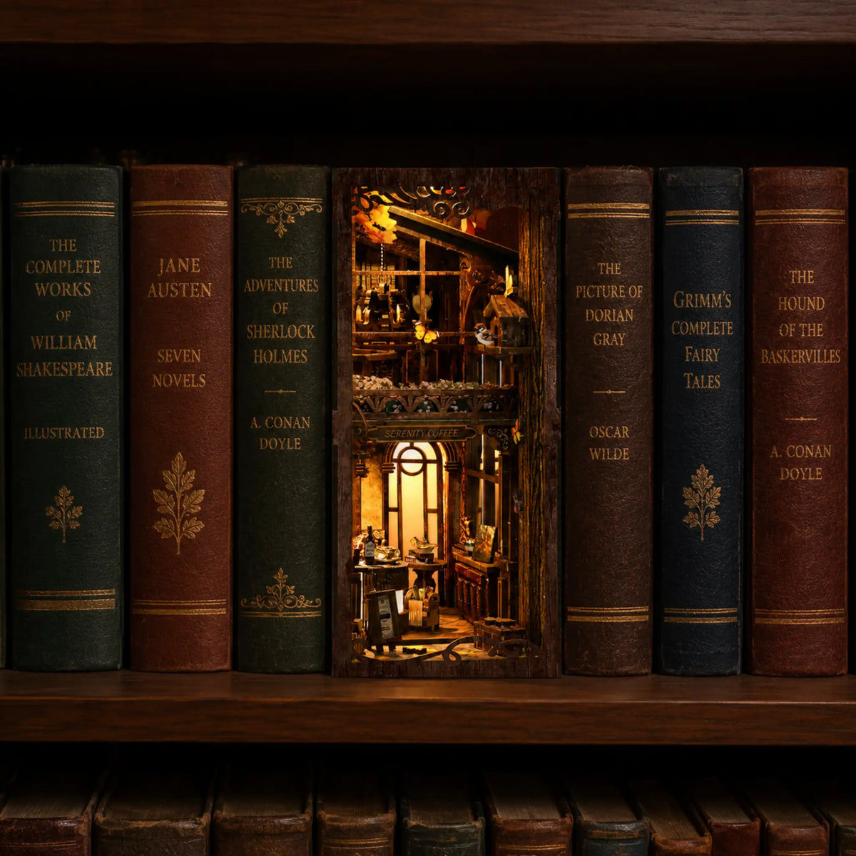 Miniature Book Nook model of a library inside a bookshelf with illuminated interior among other books.