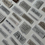 Collection of motivational stickers on a white surface