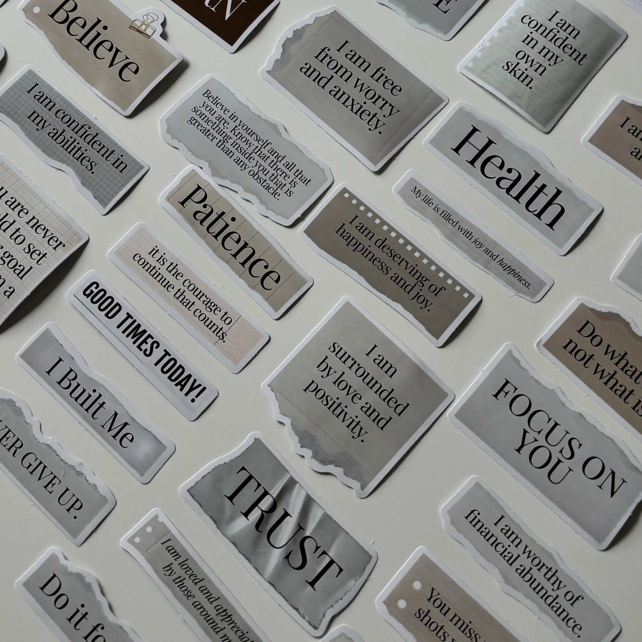 Collection of motivational stickers on a white surface