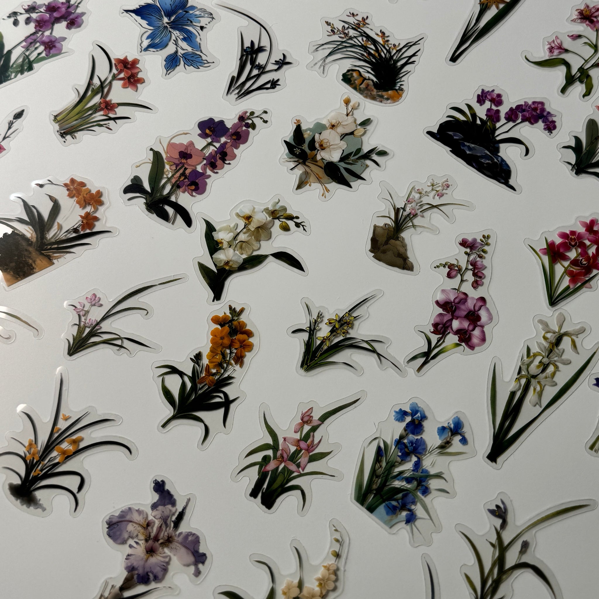 Sheet of floral stickers with various designs on a white background