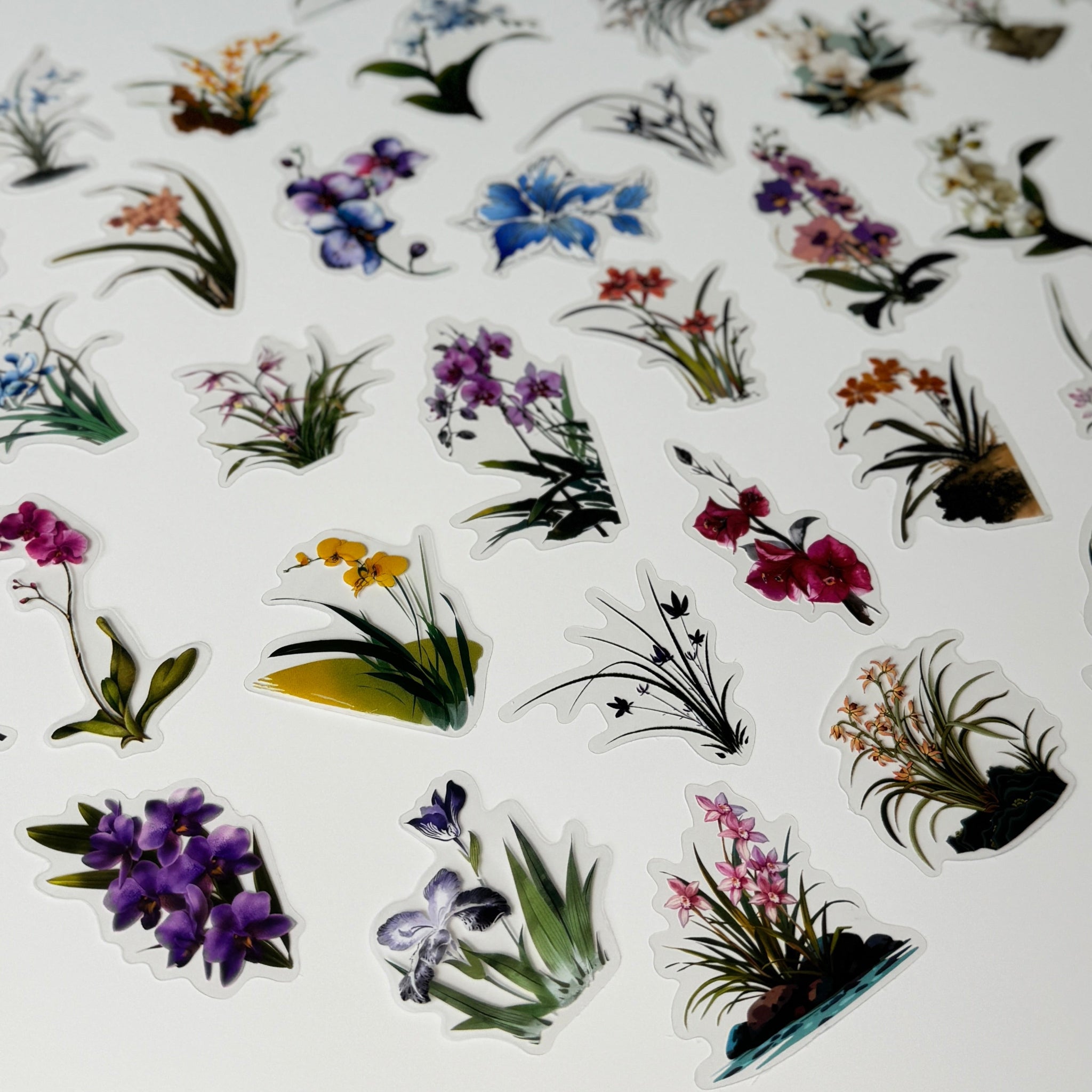 Collection of colorful floral stickers on a white surface