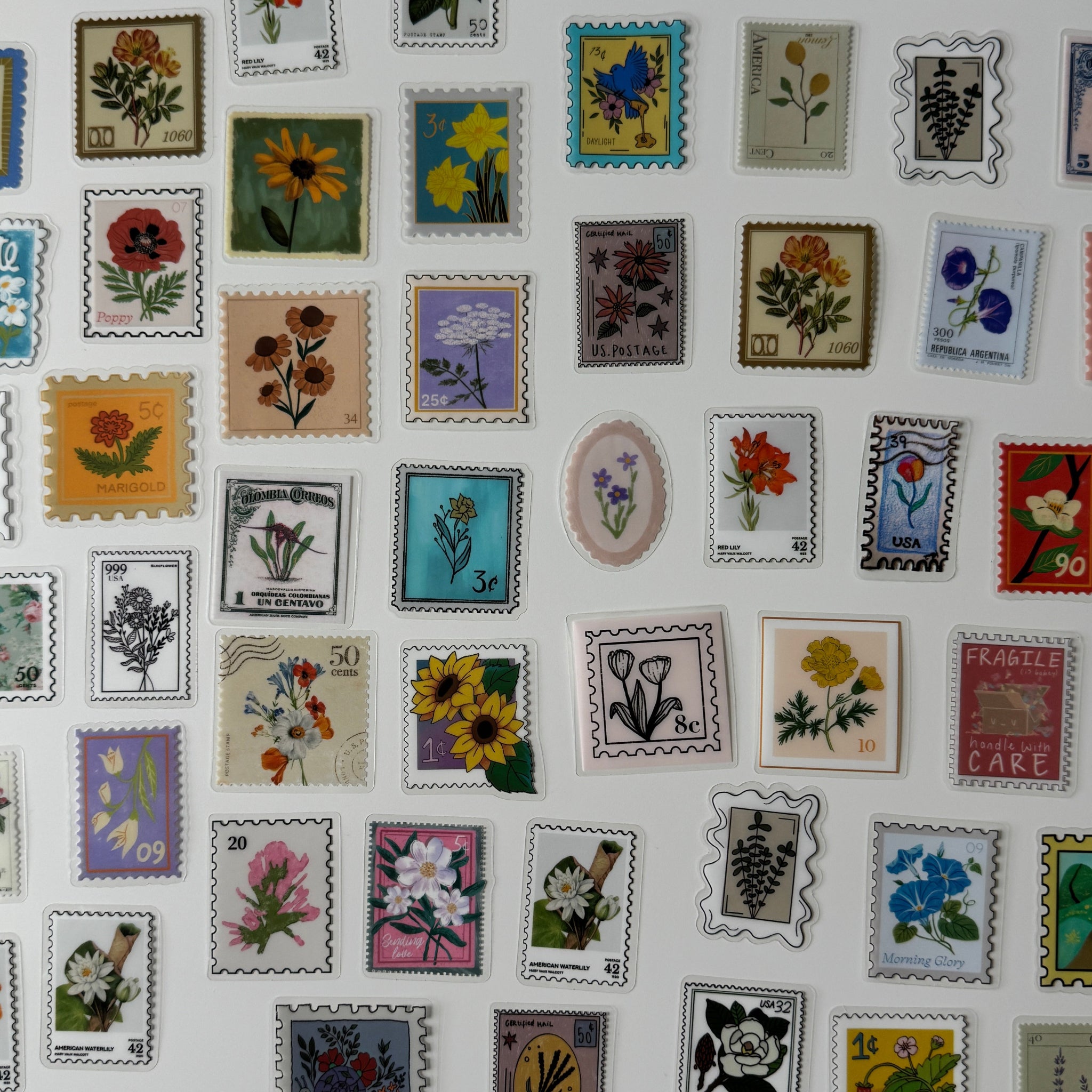 Collection of various floral-themed postage stamps on a white background