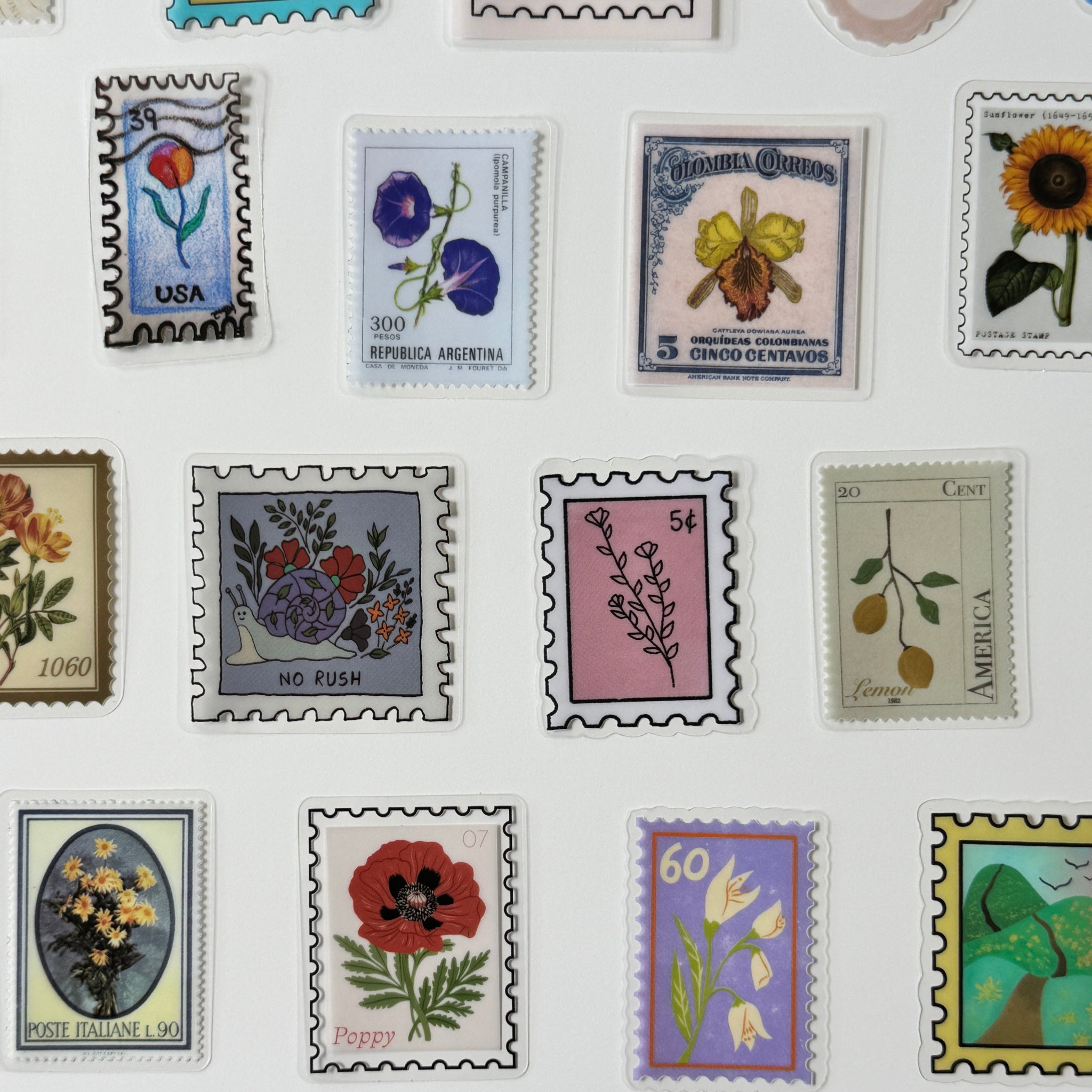 Collection of decorative stamps with floral and nature-themed designs on a white background.