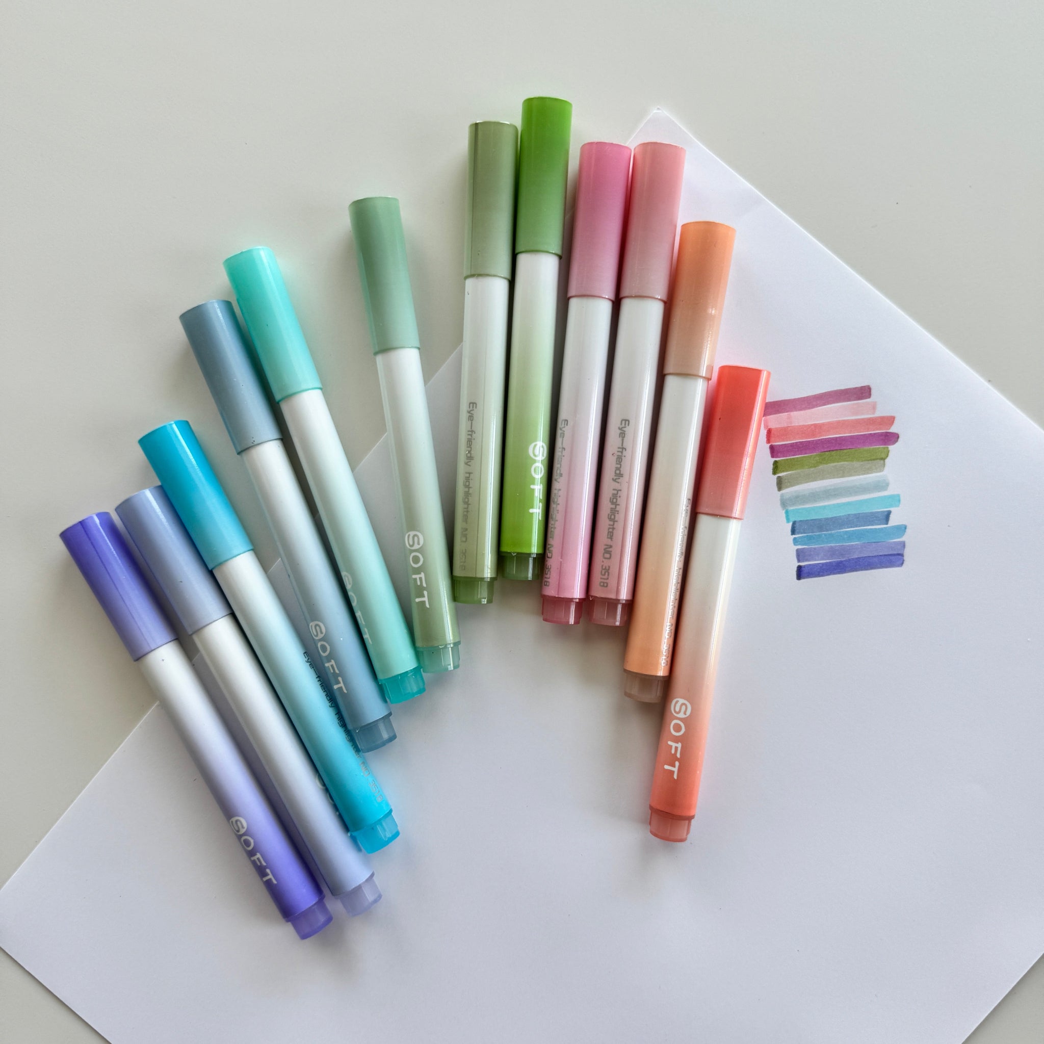 Set of colorful markers on a white background