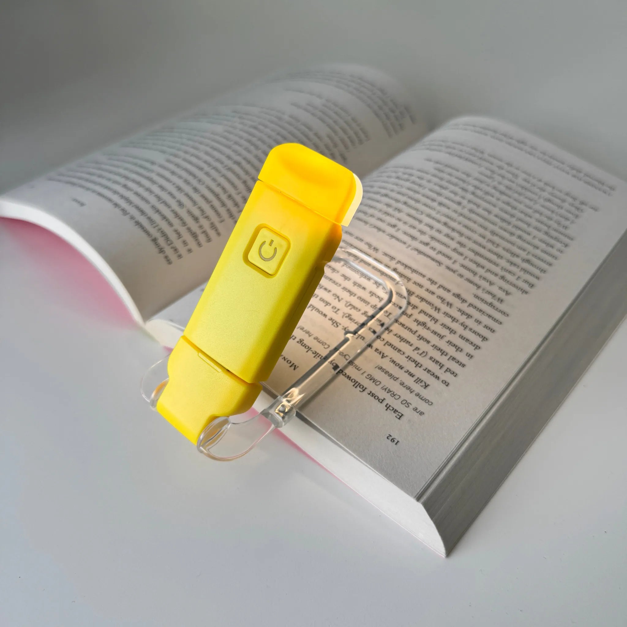 Yellow book light on an open book