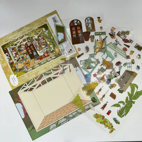 Set of miniature paper buildings and figures on a white background